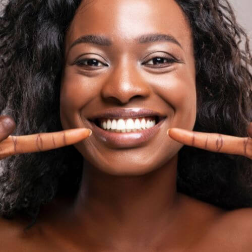 Close-up of a person's teeth showing a straight smile.